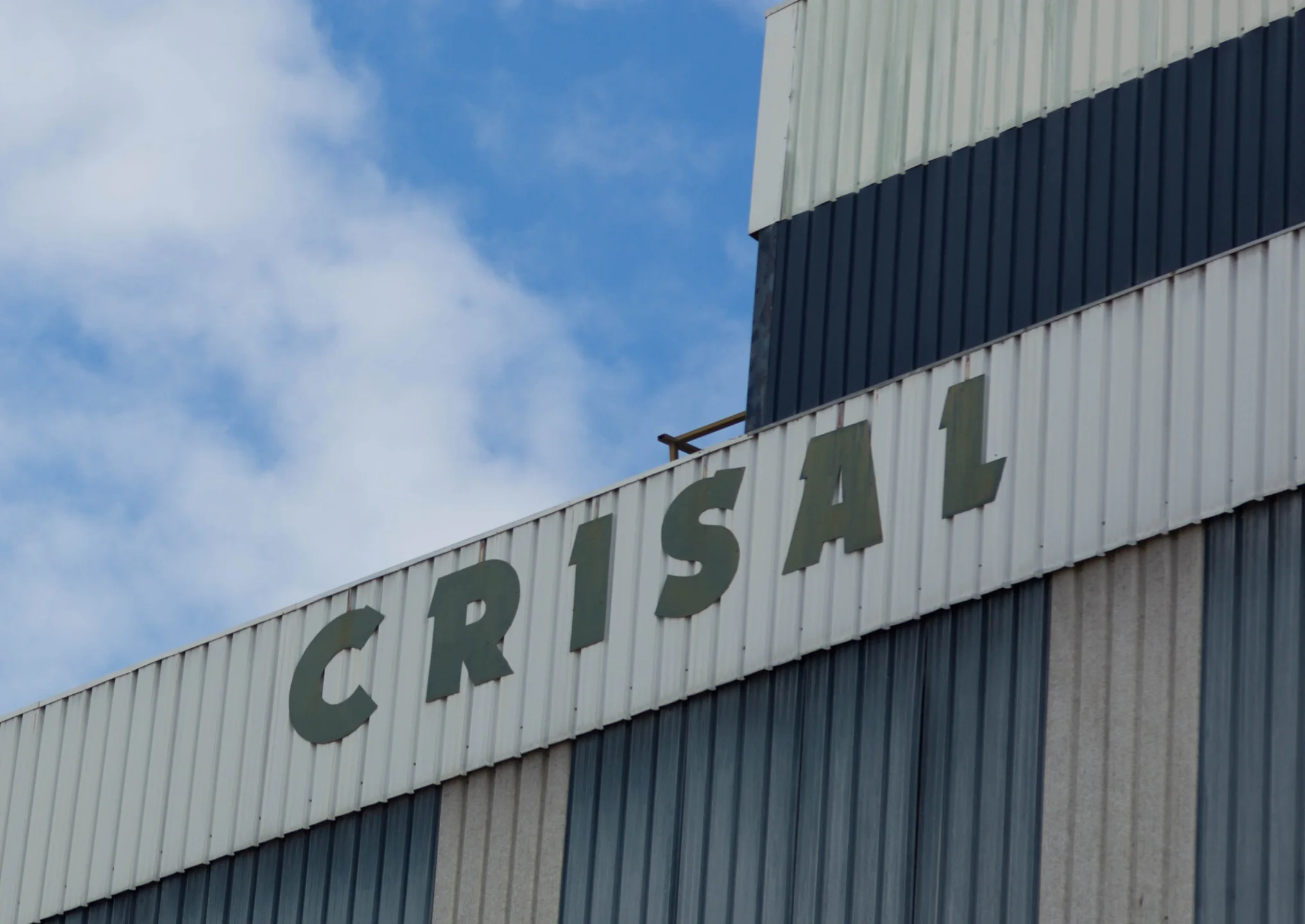 Outside frontage of factory building with “CRISAL” written
