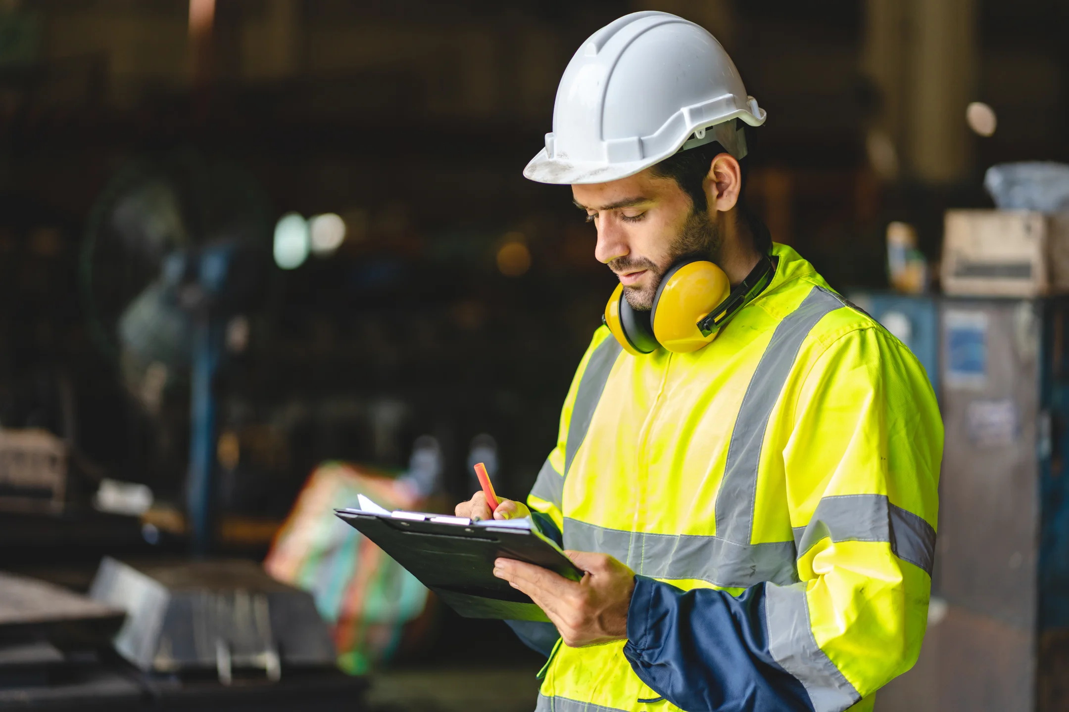 Employee working while wearing safety equipment